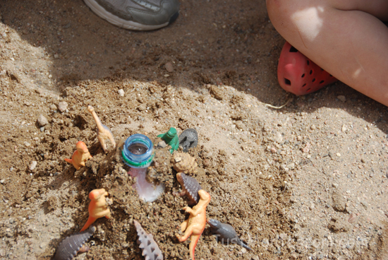 Add baking soda and red food coloring to the bottles when the volcanoes are finished.