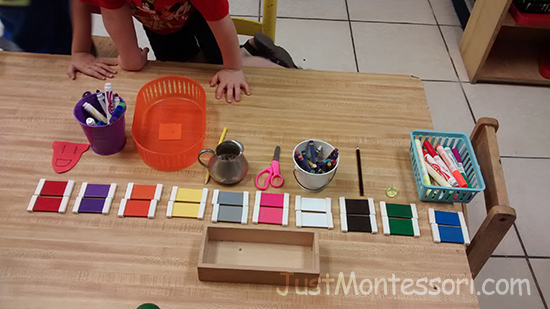 An extension of Color Box 2 : Children finding objects around the classroom that match color tablets.